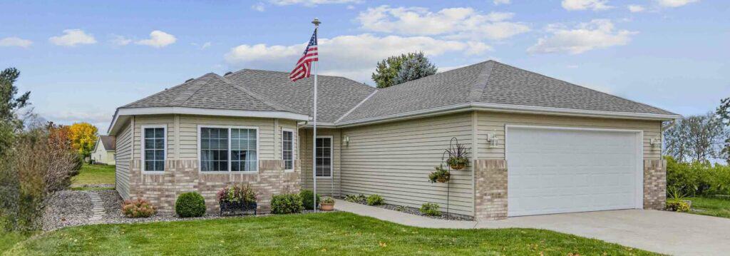 Single-story house with American flag