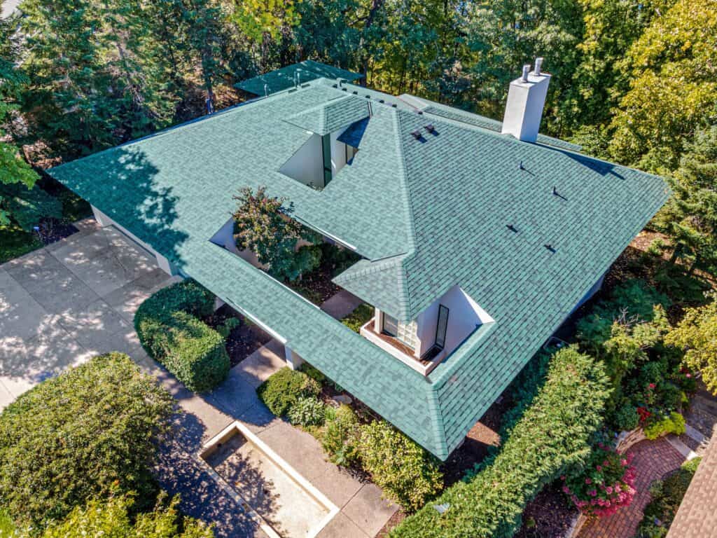 Aerial view of house with green roof.